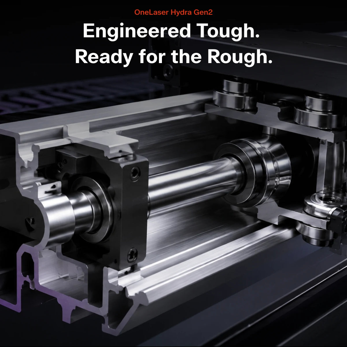 Close-up of a machined metal cylindrical roller assembly inside a machine housing, with overlaid text reading 'Engineered Tough. Ready for the Rough.